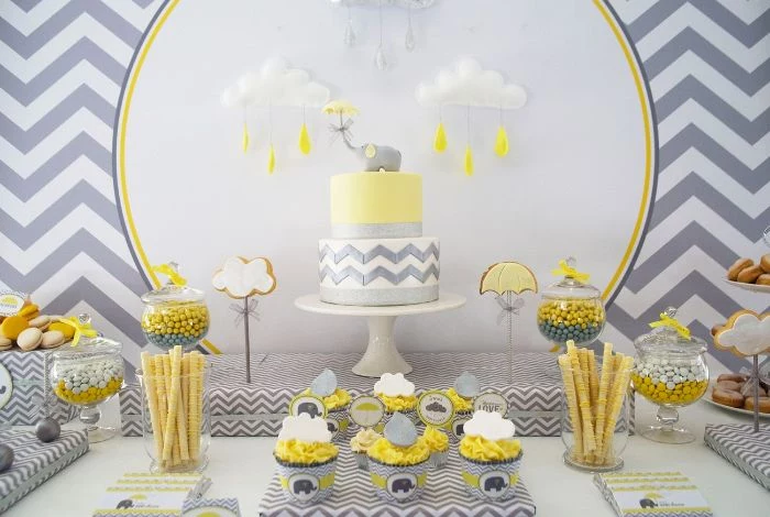 sweets candy cake placed on dessert table baby shower decoration ideas in gray yellow and white
