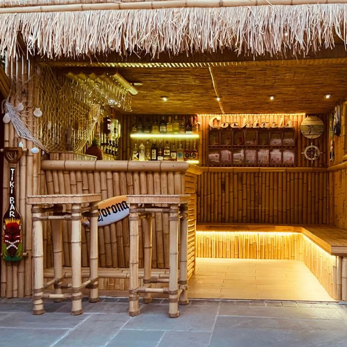 tiki bar made with bamboo and hay diy outdoor bar led benches shelves with different bottles