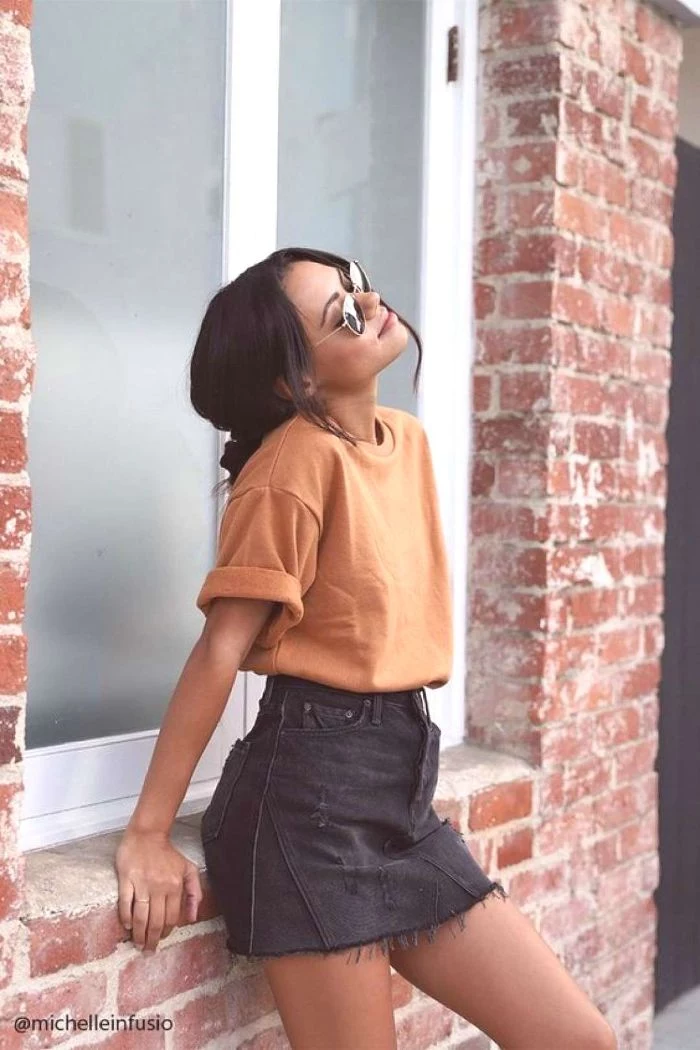 trendy clothes for teens black denim skirt orange t shirt sunglasses worn by girl with black hair