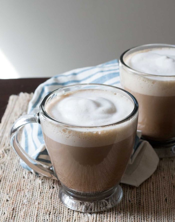 vanilla latte recipe how to make good coffee poured into small glass cup with milk foam on top