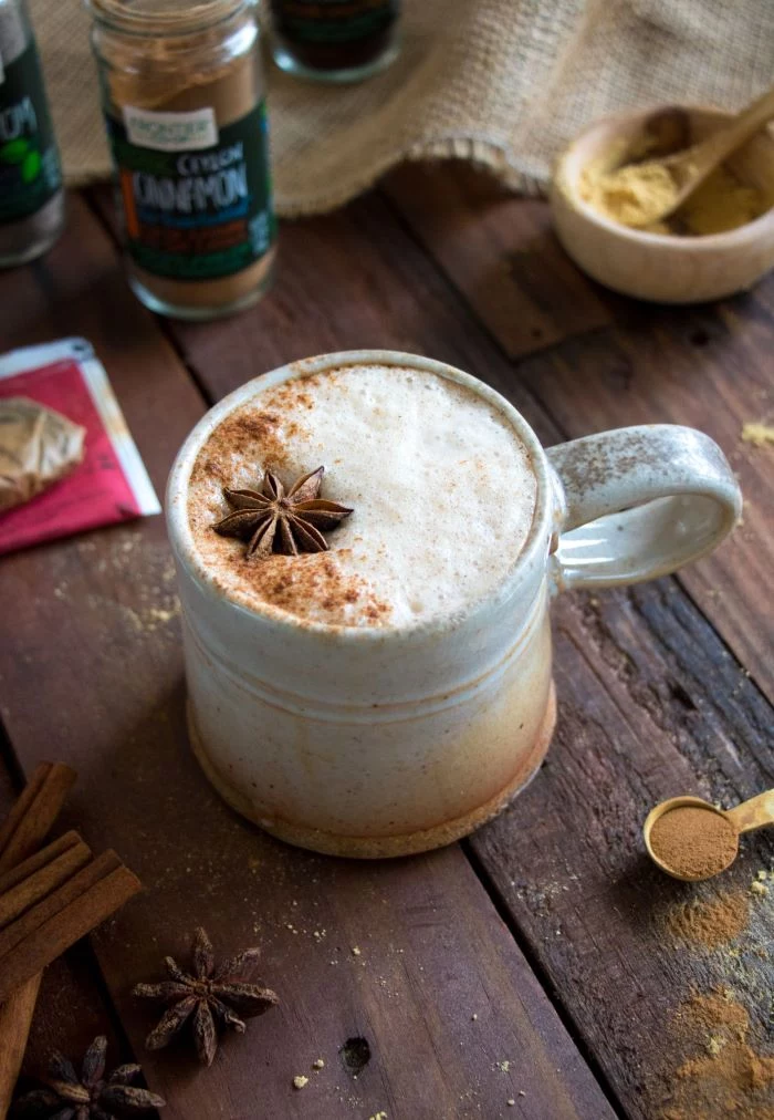 vegan chai latte recipe how to make good coffee poured into ceramic mug star anise on top