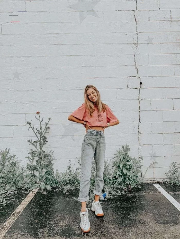 white brick wall cute outfits for teen girl wearing jeans white trainers pink t shirt
