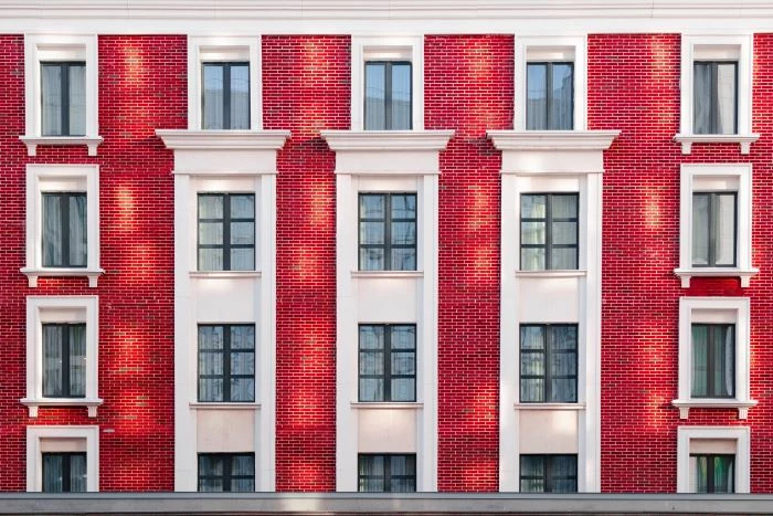 window installation apartment building with brick layout windows with black frames