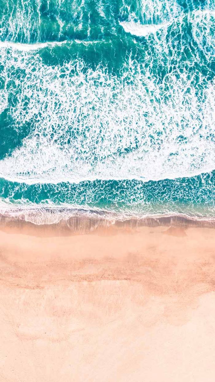 beach background iphone ocean waves crashing into the beach photographed from above