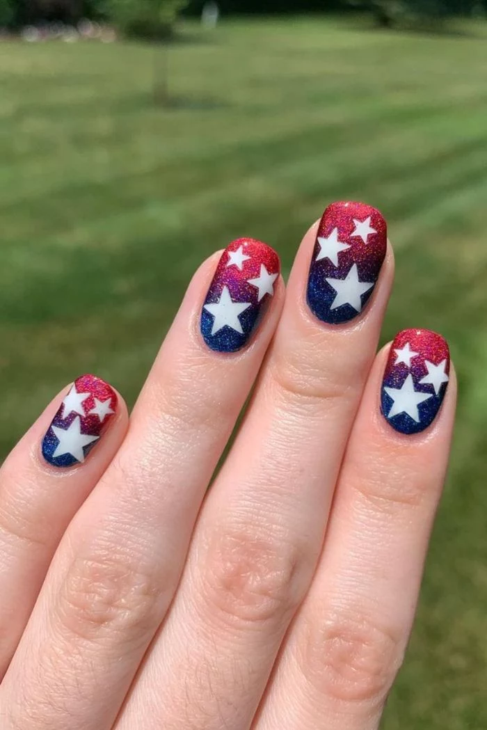 blue and red glitter ombre nail polish 4th of july nails white stars drawn on nails