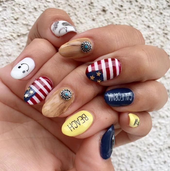 blue white red yellow beige nail polish red white and blue nails different decoration on each almond shaped nail