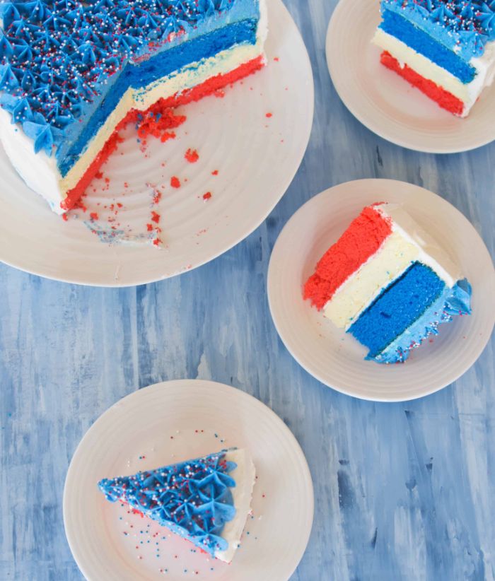 cake with three layers in red white blue fourth of july desserts decorated with red white and blue sprinkles