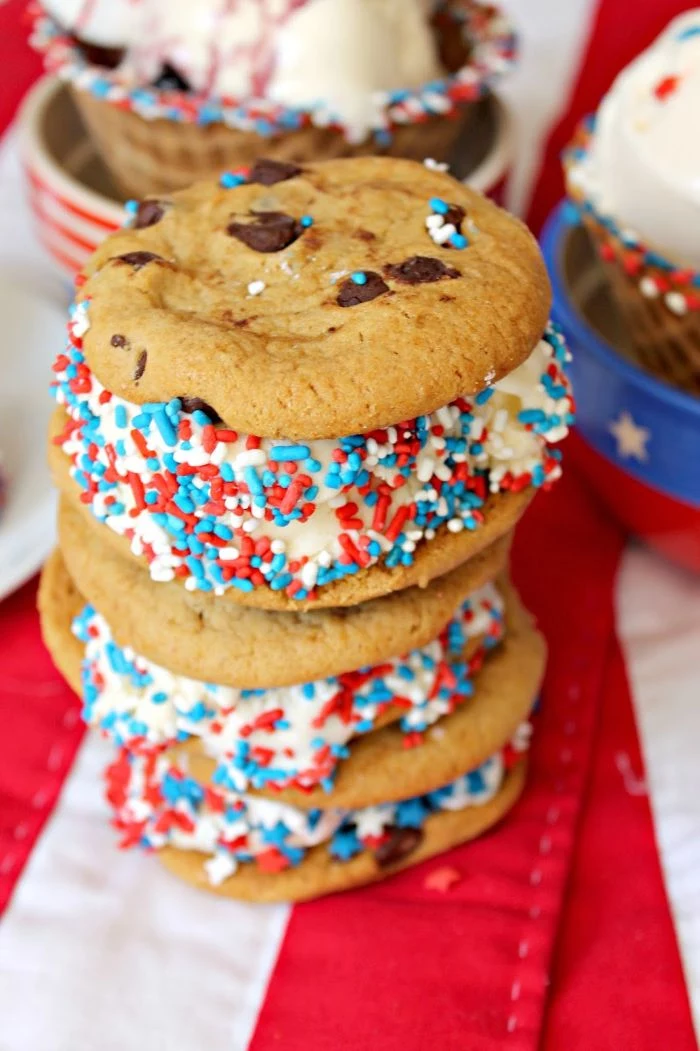 chocolate chip cookies ice cream sandwiches 4th of july desserts decorated with red white and blue sprinkles