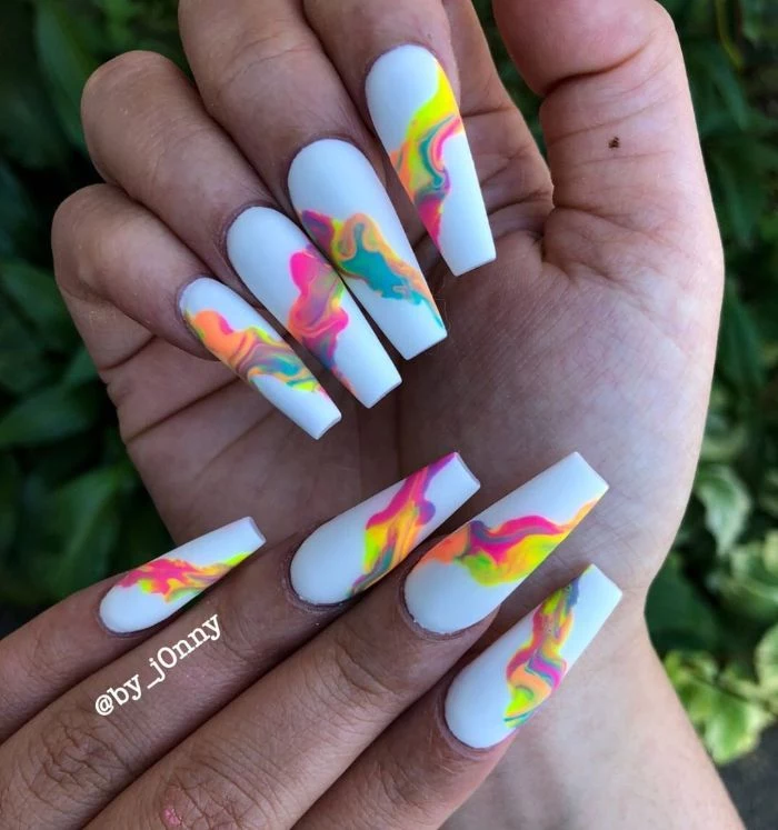 colorful abstract decorations in different colors on white nail polish summer nail ideas long coffin nails
