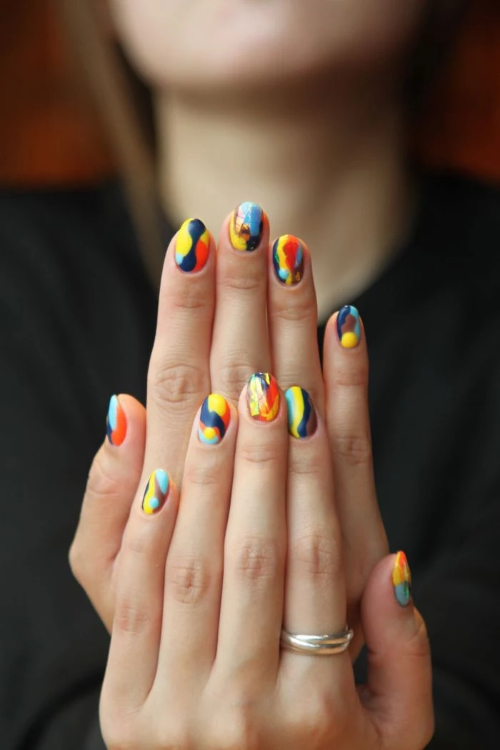 colorful abstract nails cute nail designs made with blue yellow red orange brown nail polish