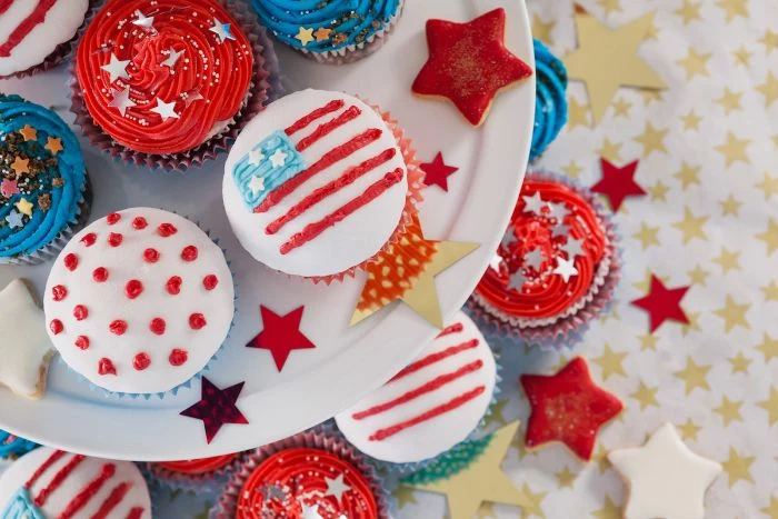 cupcakes decorated with different frosting in red white blue fourth of july recipes star sprinkles on top