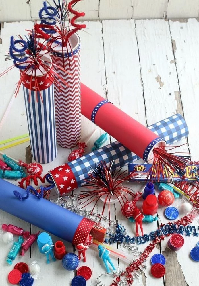 firecrackers in red white and blue placed on white wooden surface 4th of july wreath