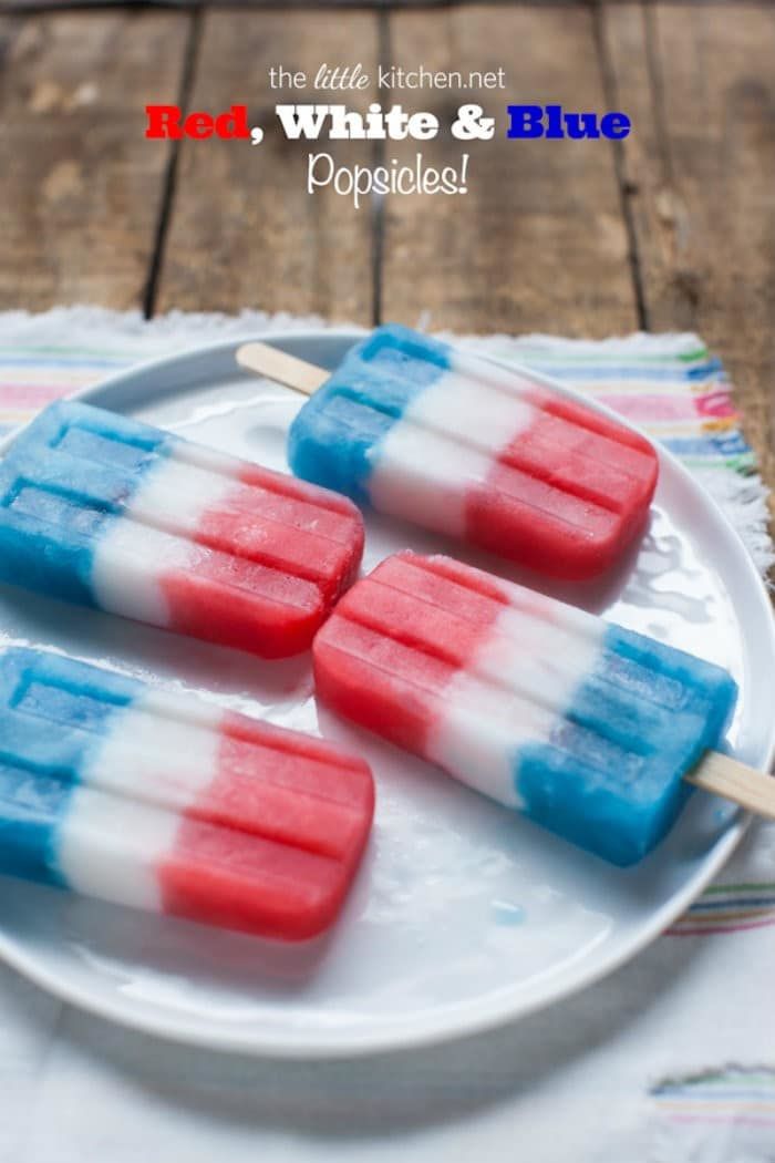 four red white and blue popsicles placed on white ceramic plate 4th of july dessert recipes