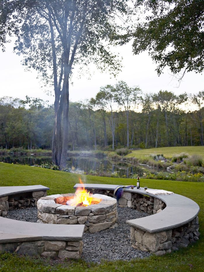 half moon benches made of stones next to diy fire pit ideas made of stones