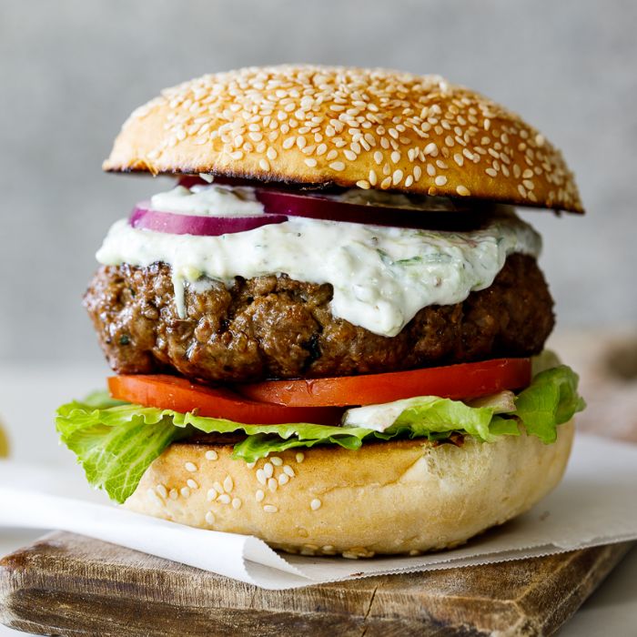 how long to grill burgers lamb burger with tzatziki sauce lettuce tomatoes onions