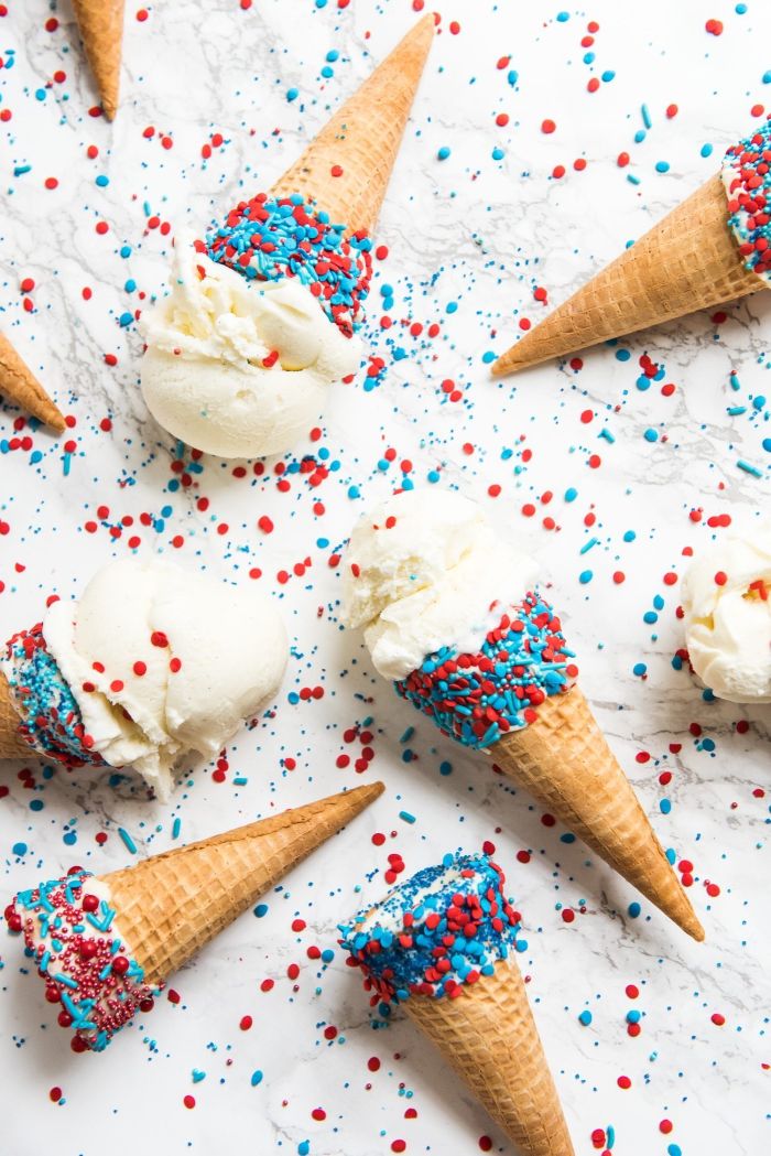 ice cream cones placed on marble surface 4th of july recipes vanilla ice cream decorated with red and blue sprinkles