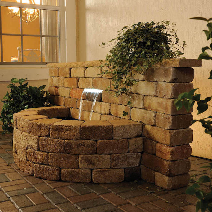 indoor water features fountain made of stone bricks surrounded by plants