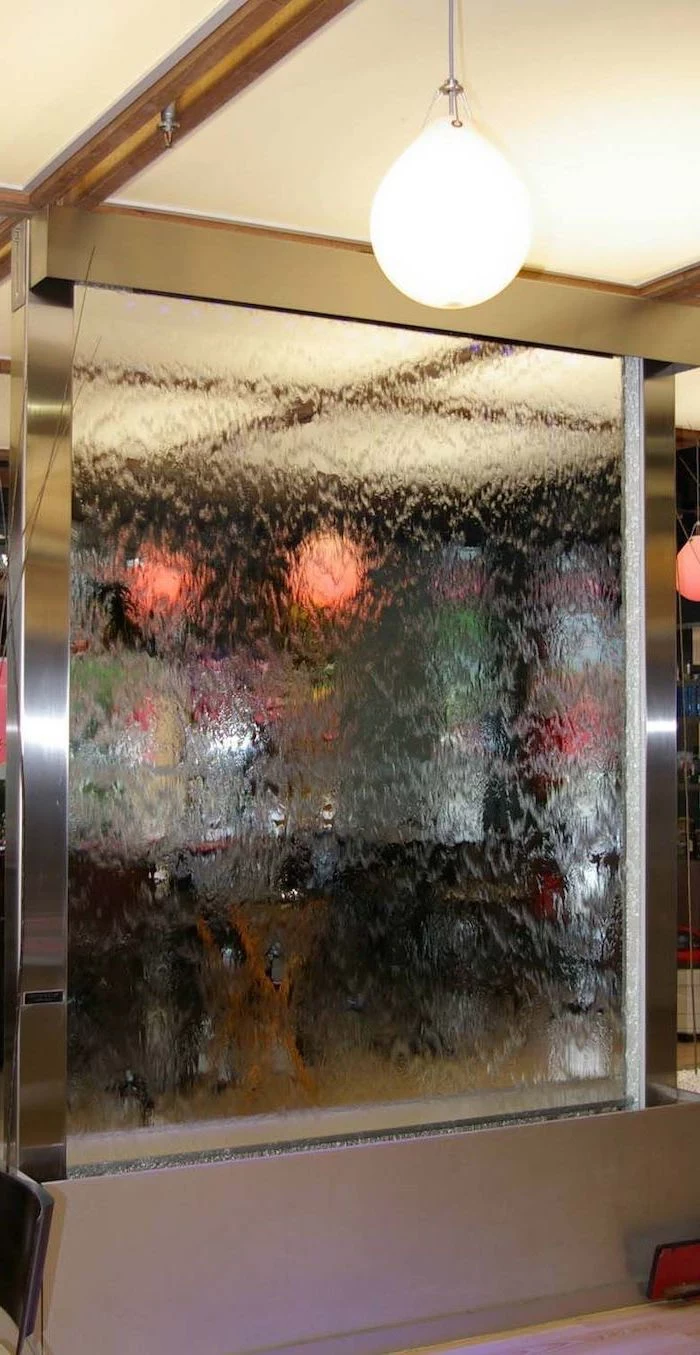 indoor waterfall glass room divider with water flowing down the glass