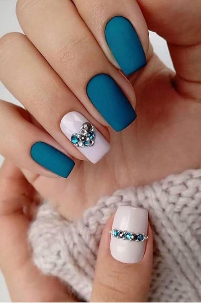 matte finish on blue nail polish summer nails 2021 rhinestones forming heart on ring finger thumb