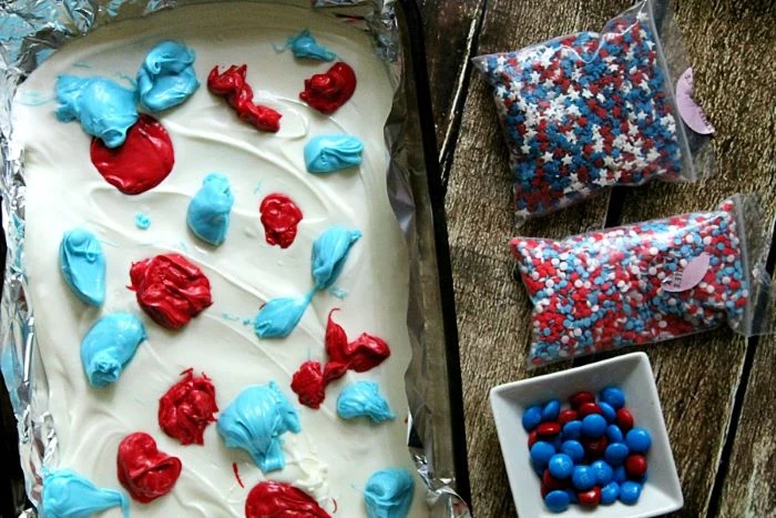 melted chocolate in white blue red in baking sheet red white and blue desserts red white blue star sprinkles m and ms