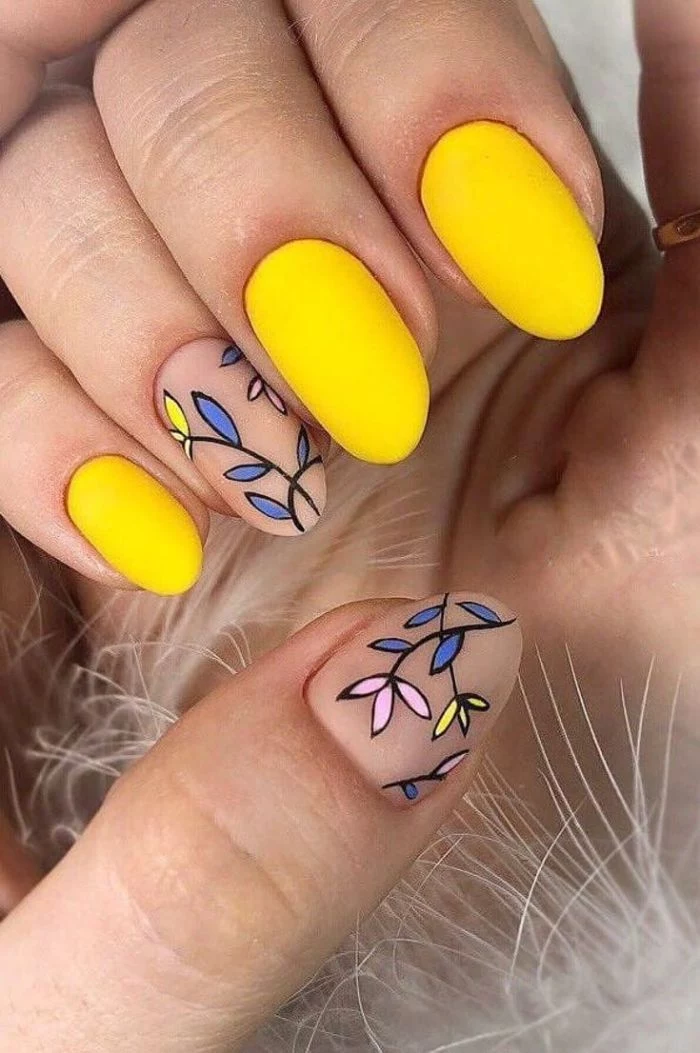 nail designs 2021 yellow and nude nail polish with matte finish floral decorations on ring finger thumb