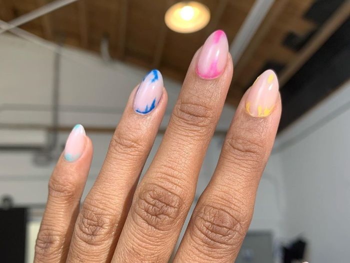 pink yellow blue abstract decorations on nude nail polish nail designs 2021 medium length almond nails