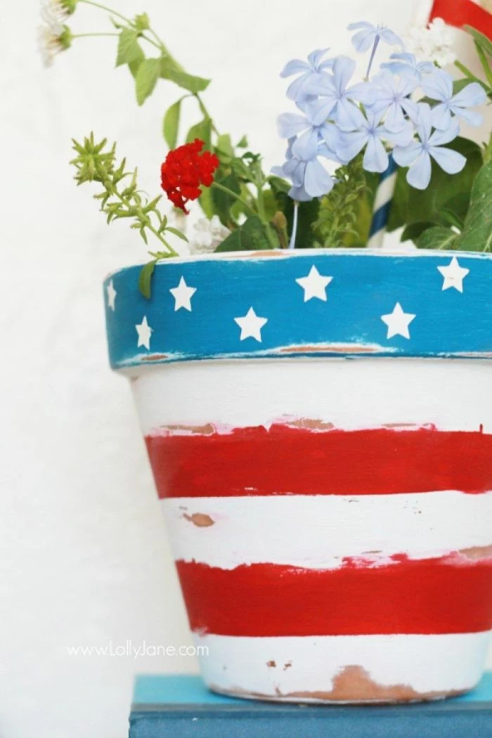 planter painted with red white stripes stars on blue background 4th of july crafts red white blue flowers