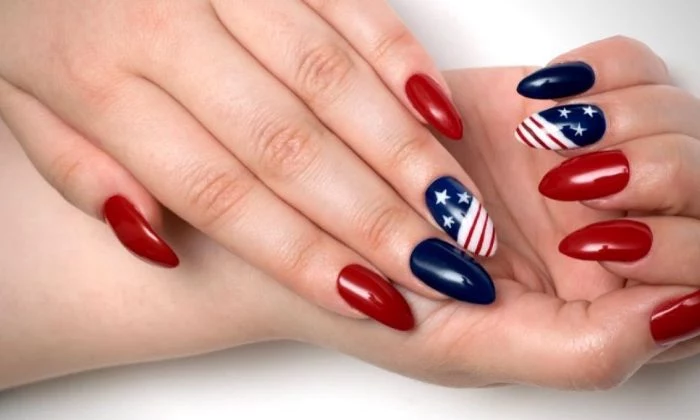 red blue nail polish on long almond nails 4th of july nail ideas american flag decorations on each ring finger