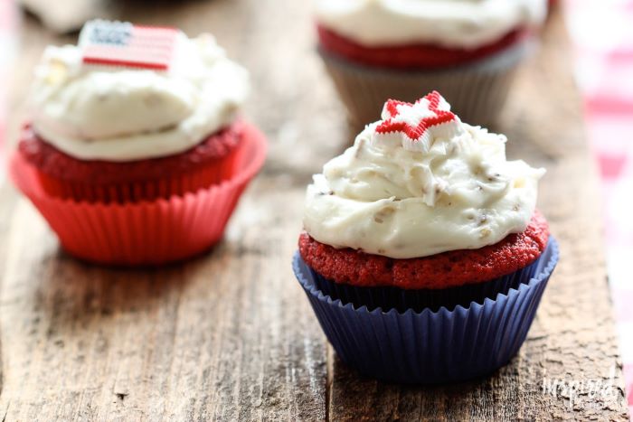 red velvet cupcakes baked in red blue cupcake holders easy 4th of july desserts decorated with white frosting