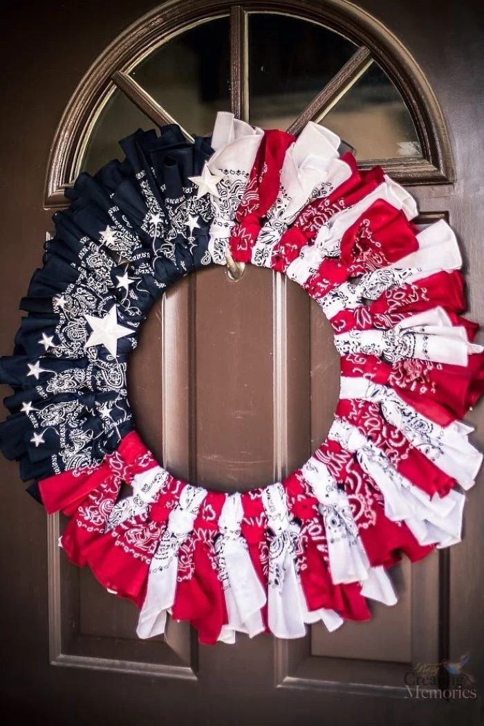 red white and blue wreath made of bandanas fourth of july wreath hanging on wooden door