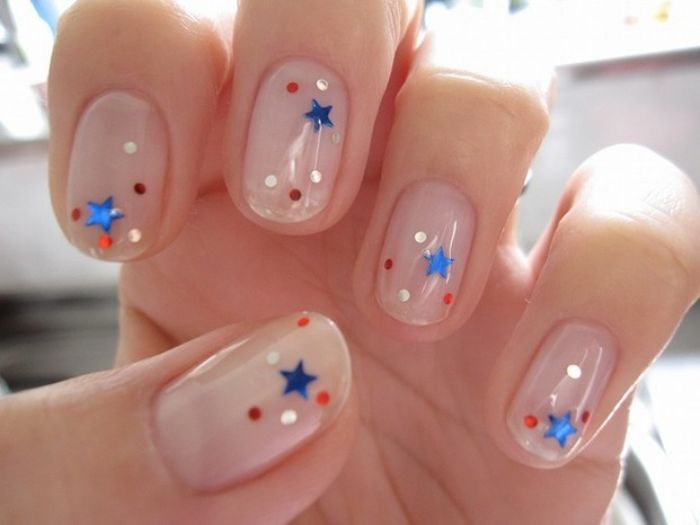 short squoval nails red white and blue nails with glitter stars decorations on each nail