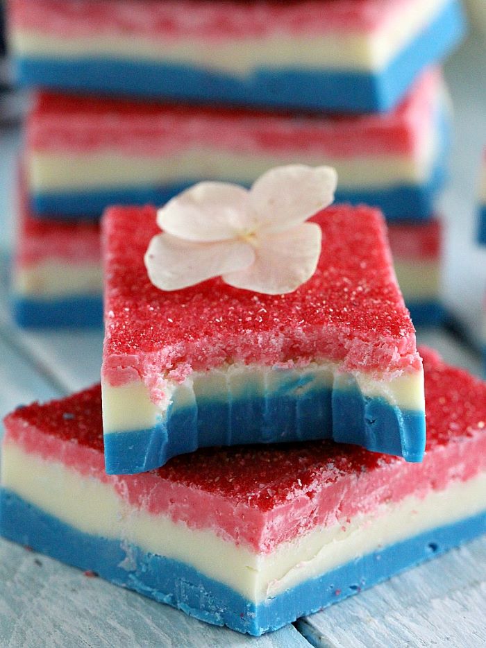 small flower placed on top of no bake fudge 4th of july dessert ideas three layers in red white blue