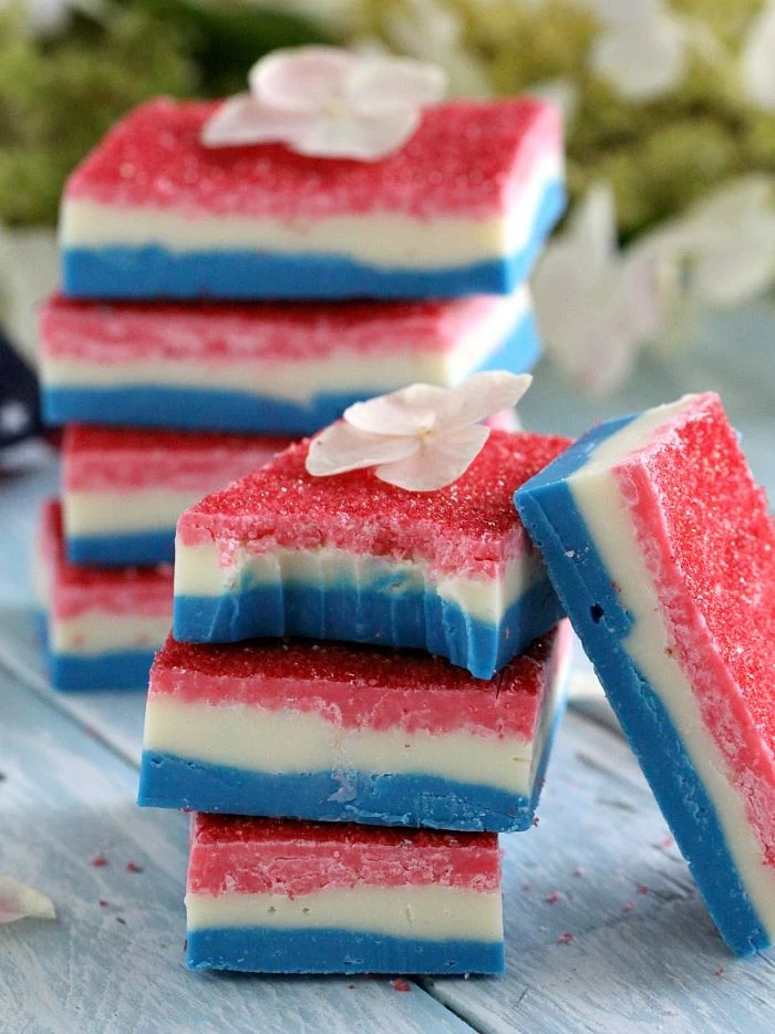 small no bake fudge bites three layers in red white blue 4th of july dessert recipes decorated with flower