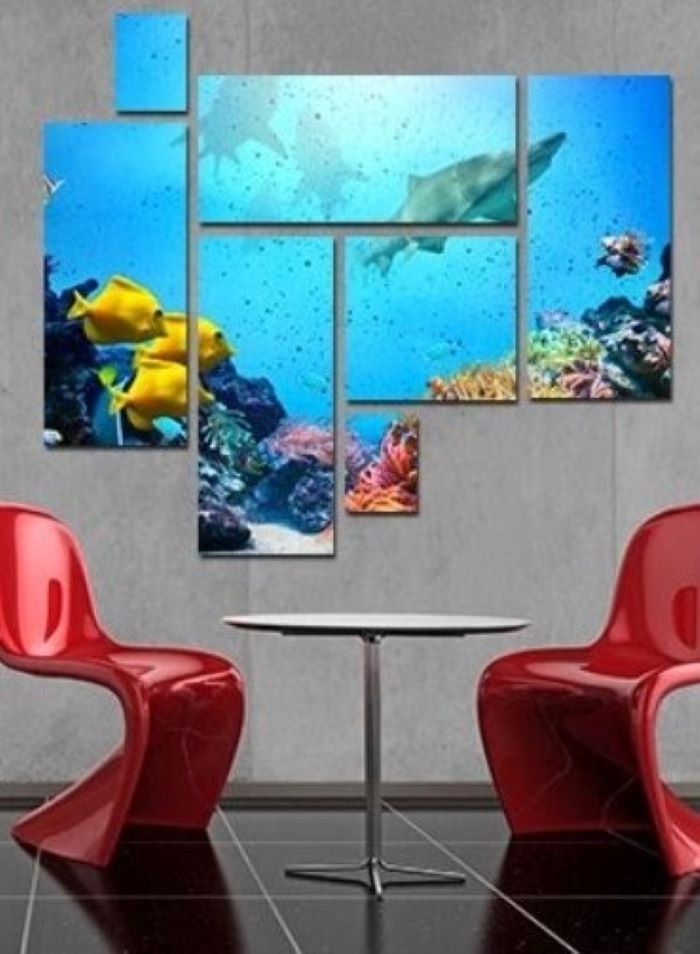 split canvas of underwater photo décor ideas for living room hanging above two red chairs round table