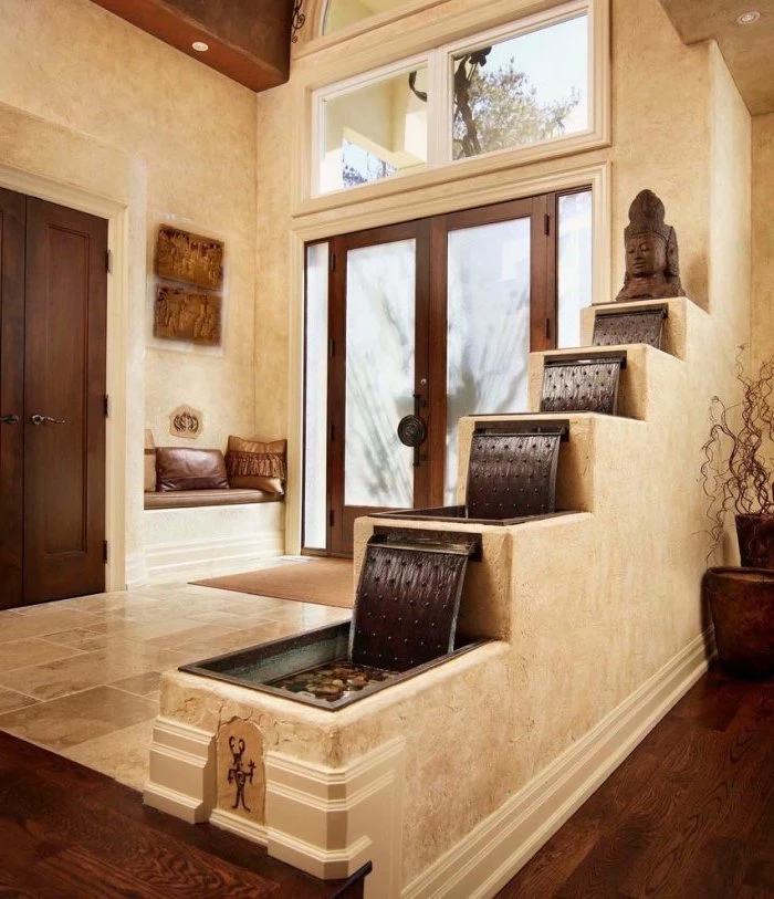 stair shaped fountain indoor water features buddha statue on the top placed right next to door