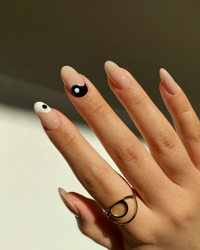 summer nail designs yin yang decorations on index and middle finger nude nail polish