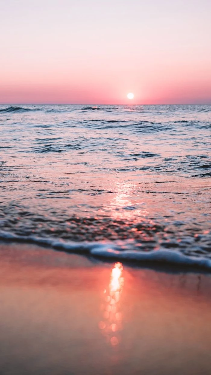 sun setting over the ocean summer iphone wallpaper waves crashing into the beach