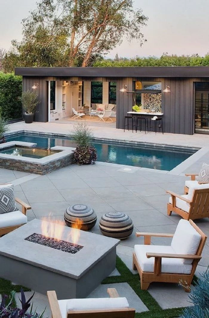 swimming pool how to build a fire pit wooden furniture with white cushion arranged around concrete fire pit