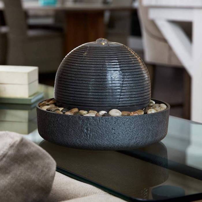 tabletop fountain indoor fountain ceramic pot filled with small rocks oval figure water flowing down