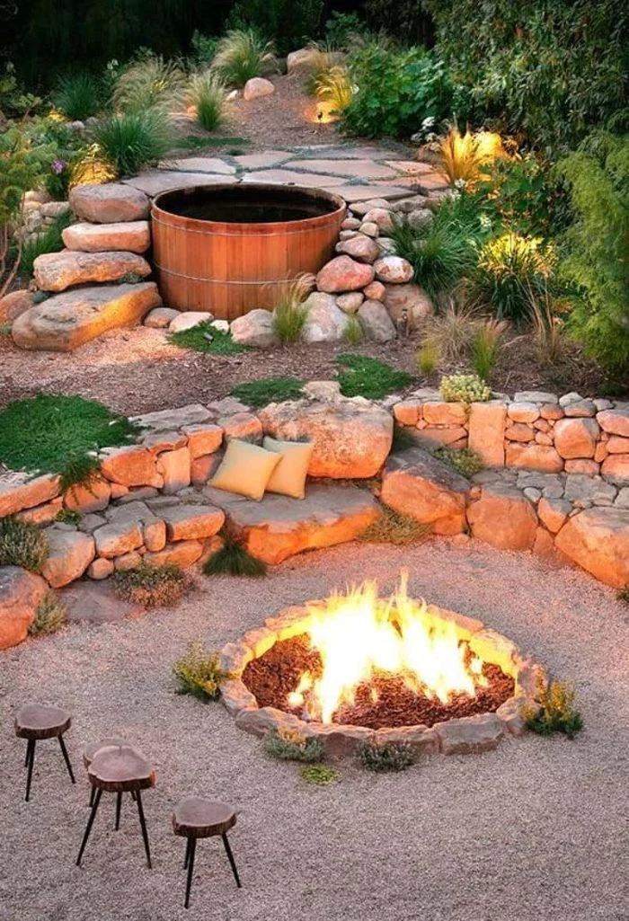 three small wooden stools next to diy fire pit ideas fire burning inside on top of gravel