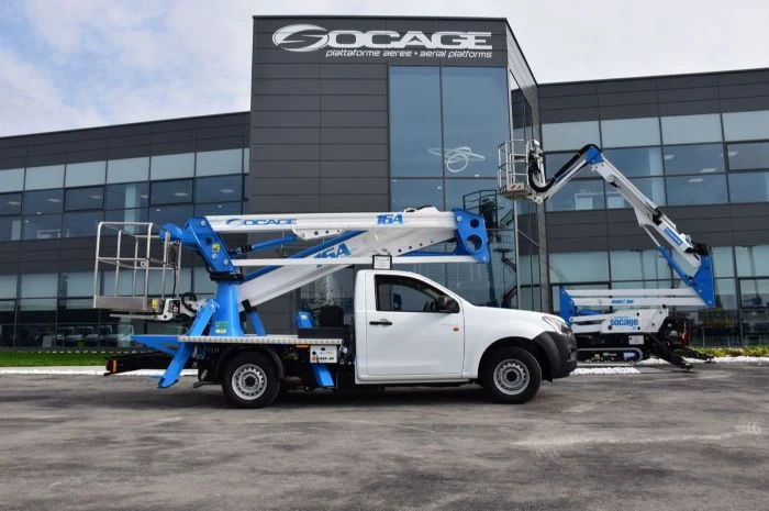 truck mounted articulated work platforms international consolidation strategy parked in front of socage building