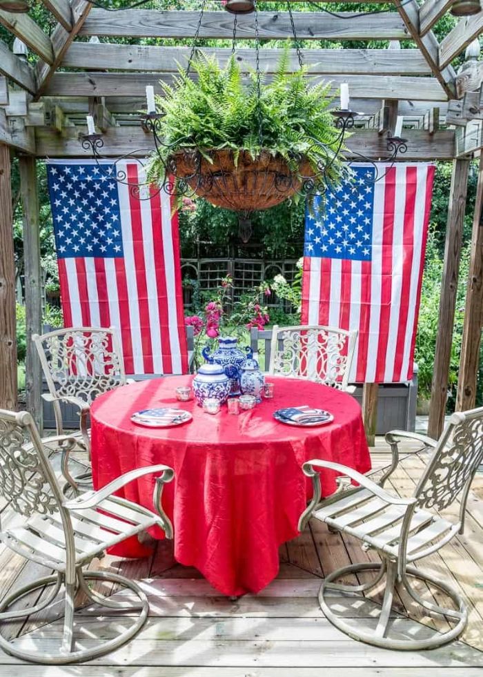 two american flags hanging behind dining table patriotic decorations patio decor