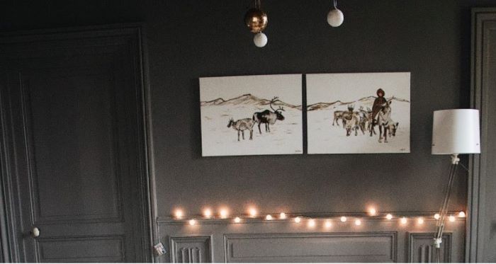 two split photos hanging on black wall decor ideas for living room fairy lights on the wall