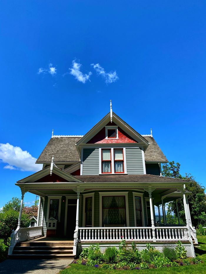 two storey house with uneven roof building your own house small porch flower bed in front