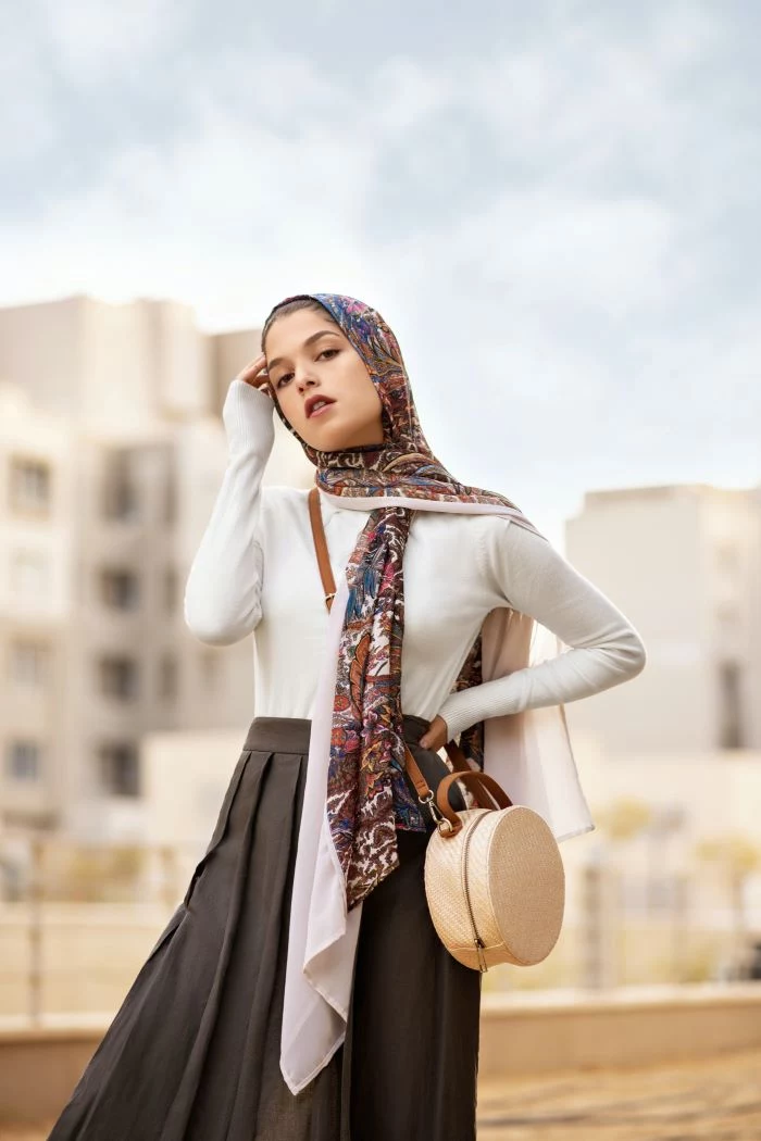 woman wearing colorful head scarf women fashion for summer 2021 black skirt white blouse