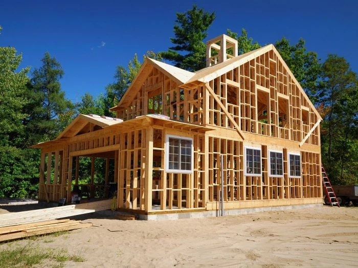 wooden house structure foundation for building your own house tall trees around it