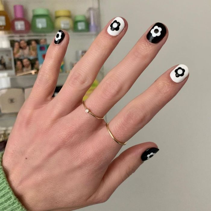 black and white nail polish with black and white flower decorations cute nail designs short nails