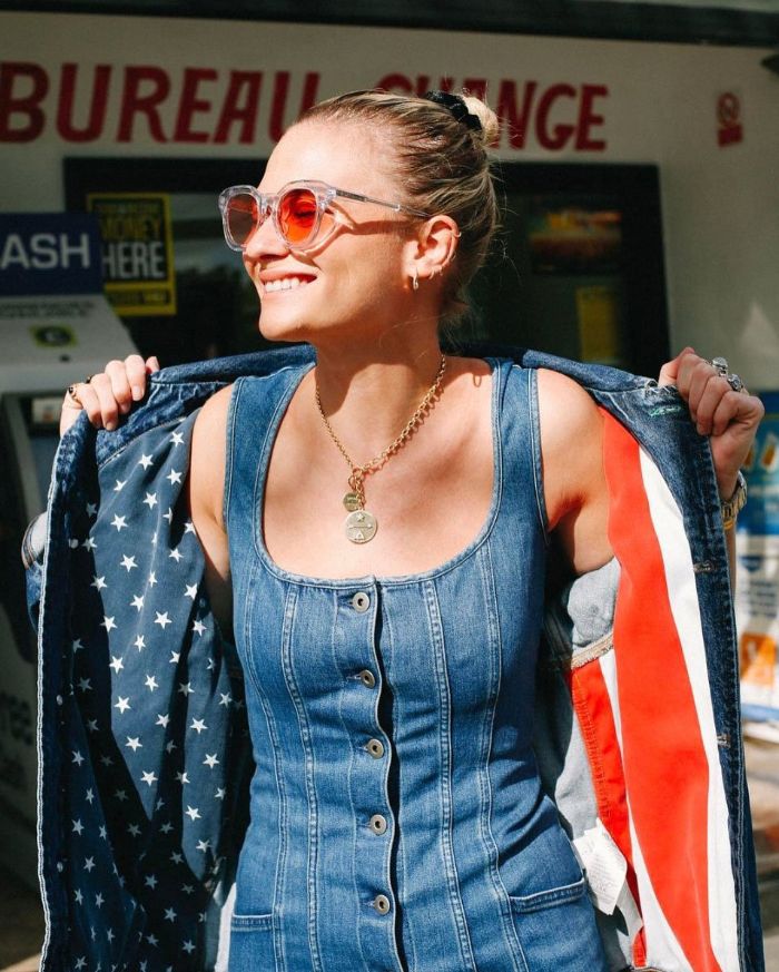 blonde woman wearing denim dress and jacket with the american flag on the inside 4th of july shirts