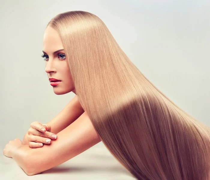 beautiful blonde woman with long, healthy and shiny hair.