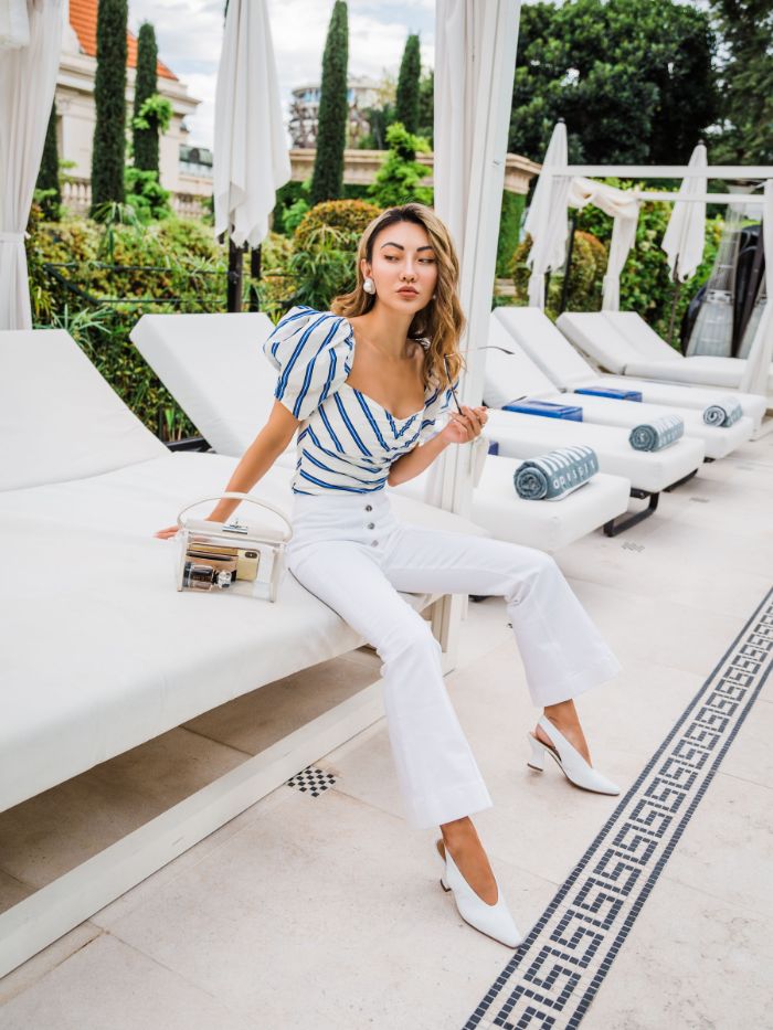 blue and white striped top with white jeans and shoes baby boy 4th of july outfit woman with blonde hair